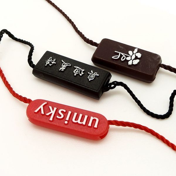 廠家直銷新款通用服裝吊粒吊繩 塑料商標(biāo)吊?？擅赓M(fèi)logo設(shè)計