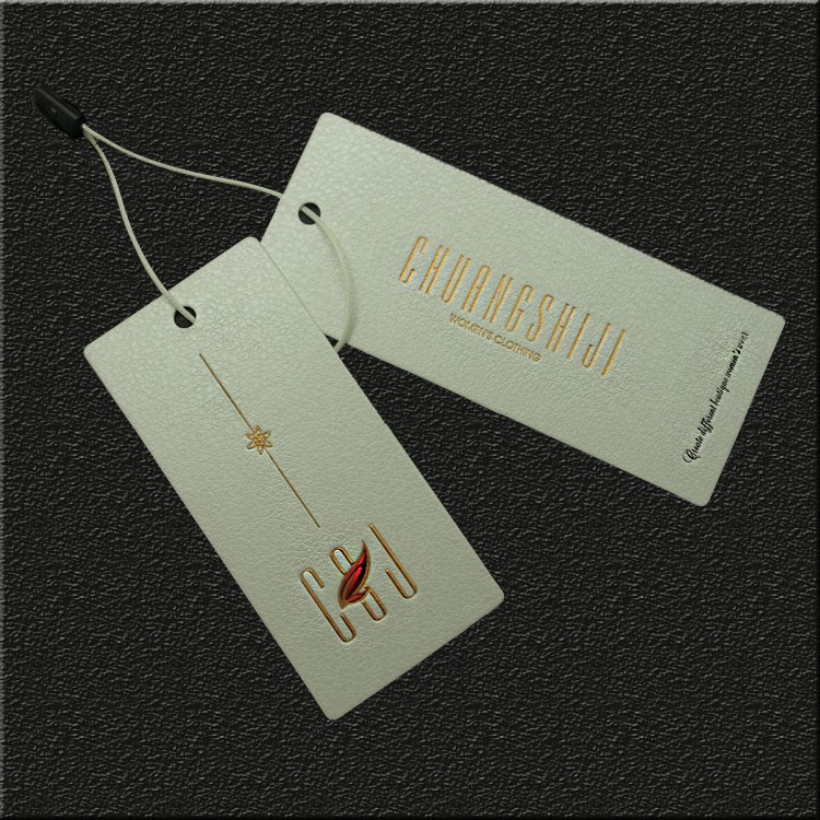廠家批發(fā)新款特種紙燙金吊牌 女裝吊卡免費(fèi)設(shè)計輔料定做服裝標(biāo)簽